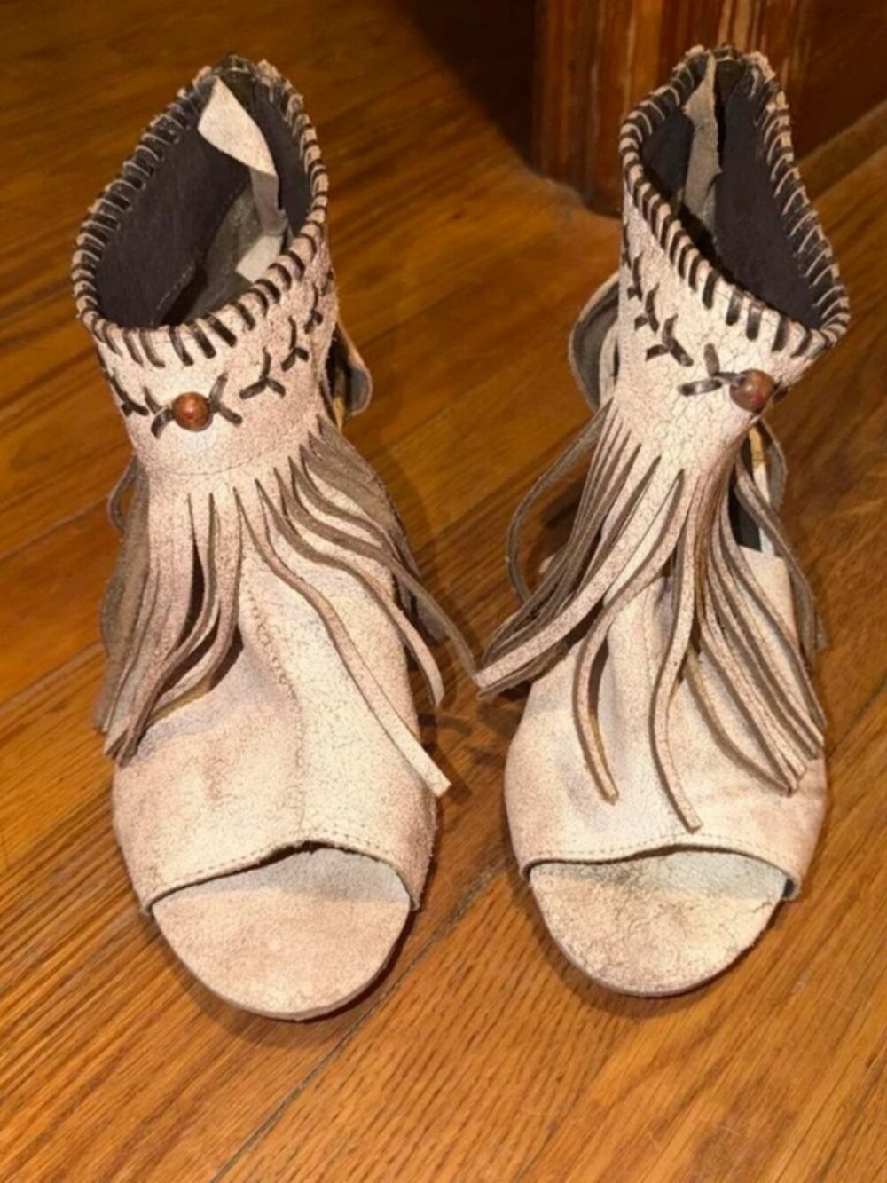 White & cream fringe ankle boots with brown stitching and decorative beads